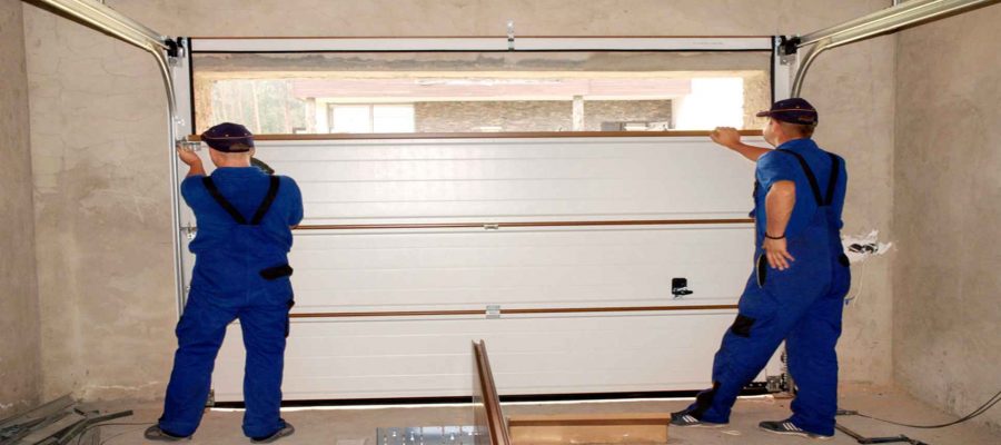 Men Installing A Garage Door-Garage Door Repair