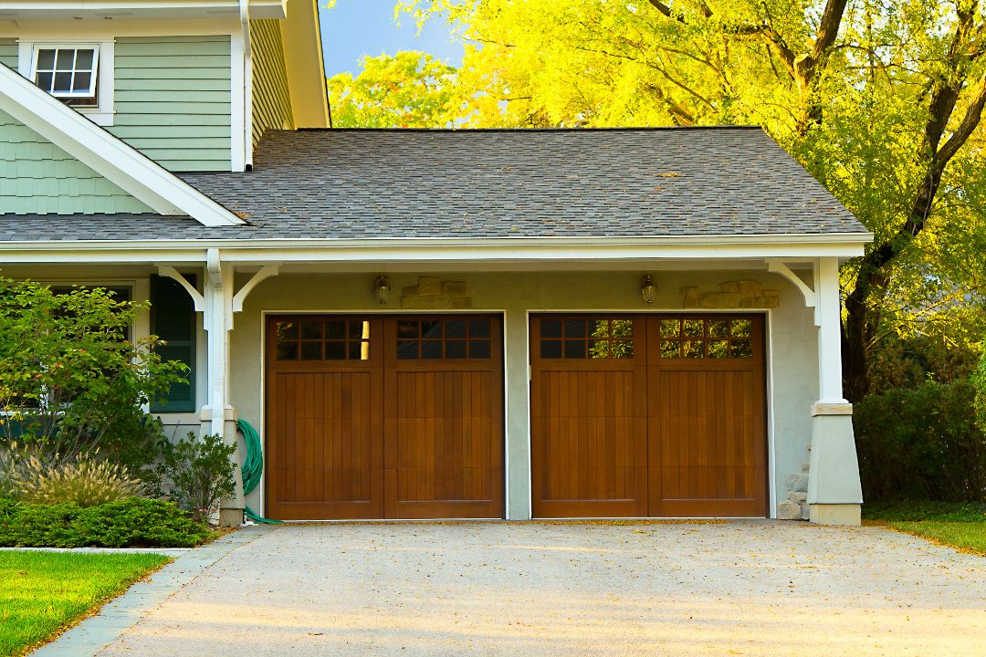 two_car_garage_with_brown_wood_garage_door_-_garage_door_repairs_in_pensacola_-_pensacola_overhead_door_&_operator.jpg